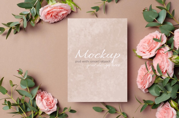 invitation or greeting card mockup with roes and eucalyptus flowers