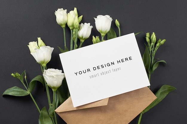 PSD invitation or greeting card mockup with white eustoma flowers on black