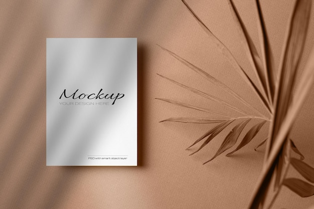 Invitation or greeting card, stationary mockup with dry nature palm leaf