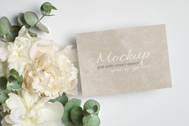 Invitation or greeting card stationary mockup with white peony flowers 