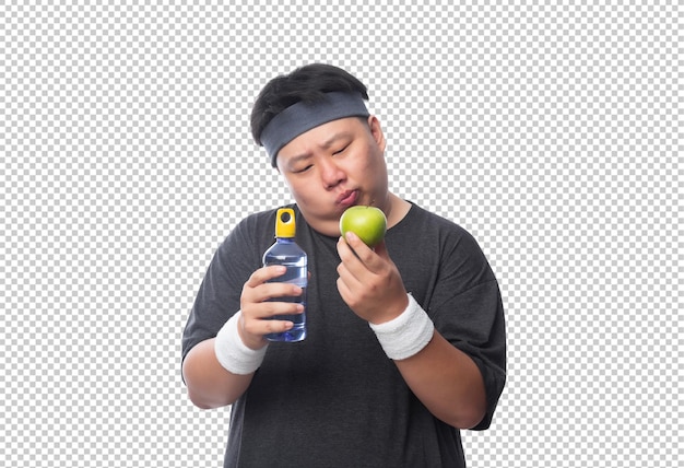 Jonge aziatische grappige dikke sportman met waterfles en groene appel psd-bestand