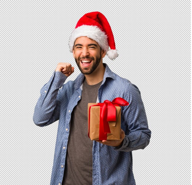 Jonge man met kerstmuts dansen en plezier hebben