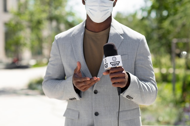 PSD journalist holding a microphone mockup