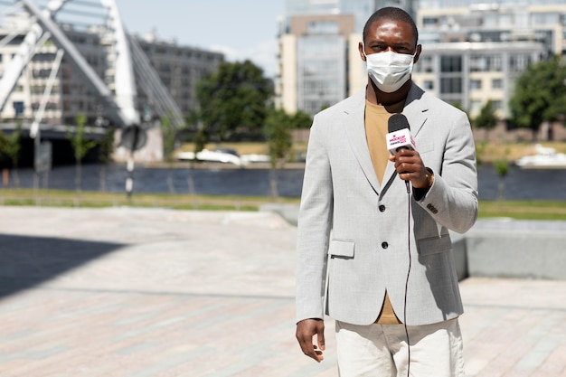 Journalist holding a microphone mockup