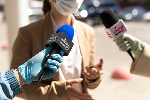 PSD journalist holding a microphone mockup