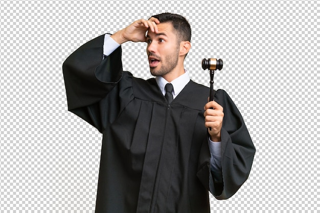 judge caucasian man over isolated background doing surprise gesture while looking to the side