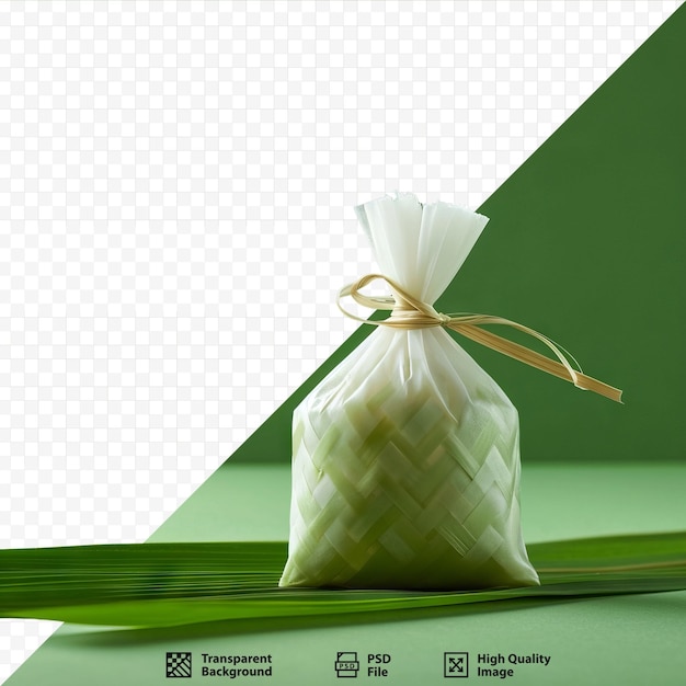 PSD ketupat or rice dumpling decoration over green isolated background selective focus