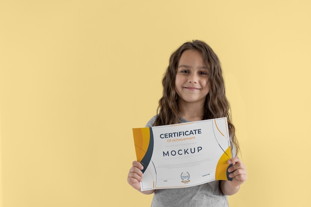 PSD kid holding certificate mockup