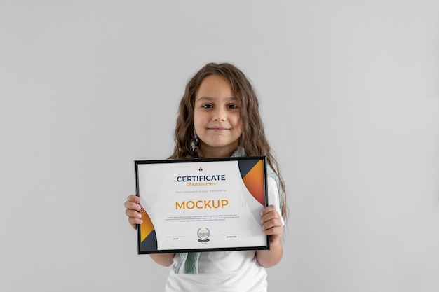 Kid holding certificate mockup