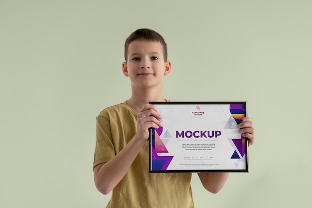 PSD kid holding certificate mockup