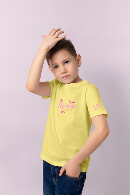 PSD kid wearing tshirt mockup design