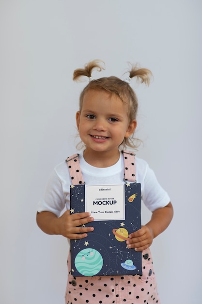 Kid with book  in studio mockup