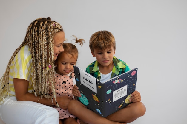 Kid with book  in studio mockup