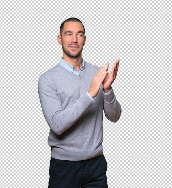 Kind young man doing an applauding gesture