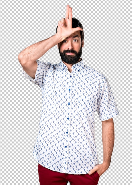 Knappe donkerbruine mens die met baard stom teken maken