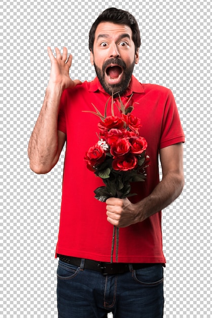 PSD knappe man met bloemen maken verrassing gebaar