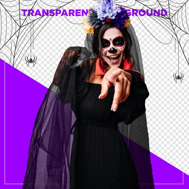 Kobieta ubrana na Halloween w tradycyjny meksykański kostium wskazująca do przodu