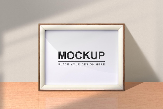 Landscape photo frame mockup Wooden frame mockup on the table with shadow overlay effect