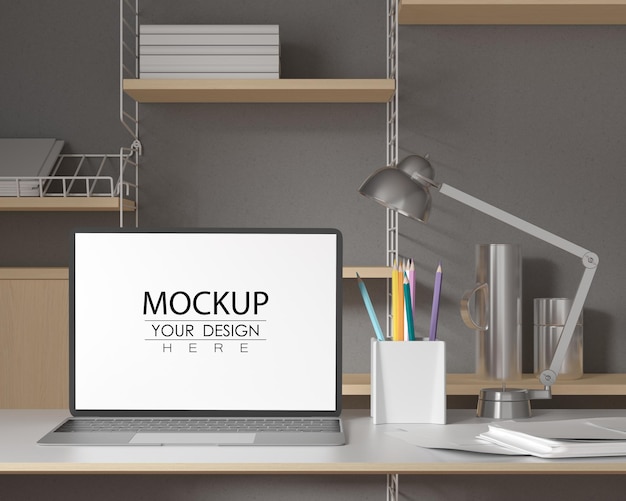 Laptop on desk in work space psd mockup