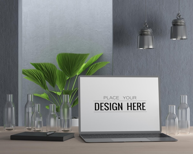 Laptop on desk in work space PSD mockup