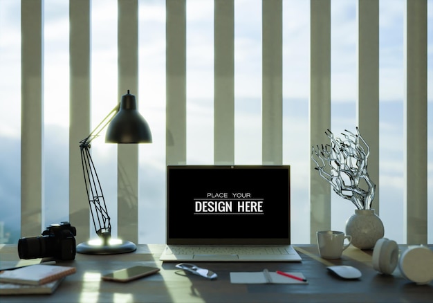 laptop on desk in workspace mockup