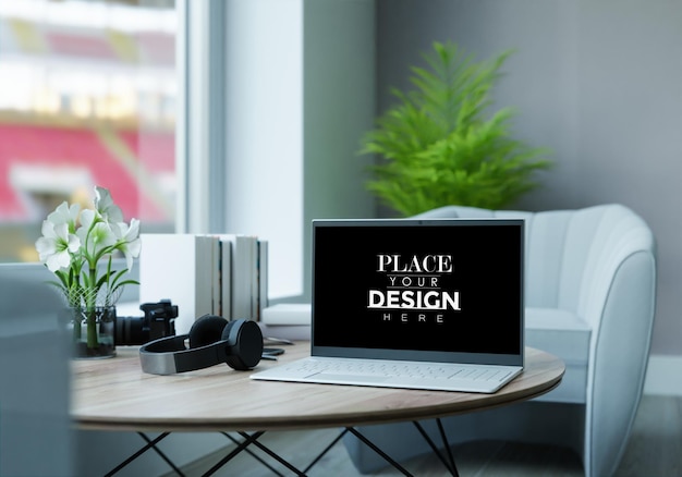 Laptop on desk in workspace mockup