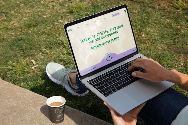 Laptop device view with coffee cup