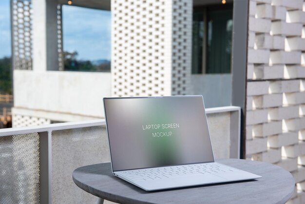 Laptop on gray table mockup