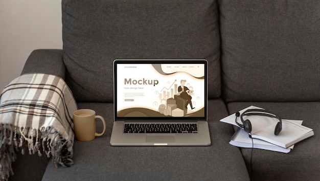 Laptop mock-up on gray sofa