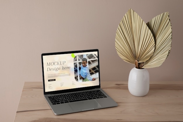 PSD laptop mock-up with wooden furniture scene