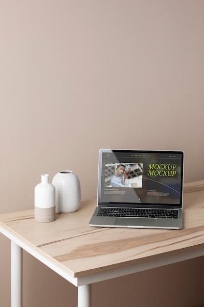 PSD laptop mock-up with wooden furniture scene