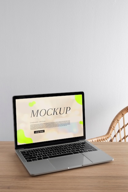 PSD laptop mock-up with wooden furniture scene