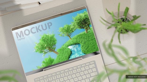 Laptop mockup sul muro di mattoni bianchi anteriore pavimento di cemento alto angolo di tiro ombra di albero e finestra