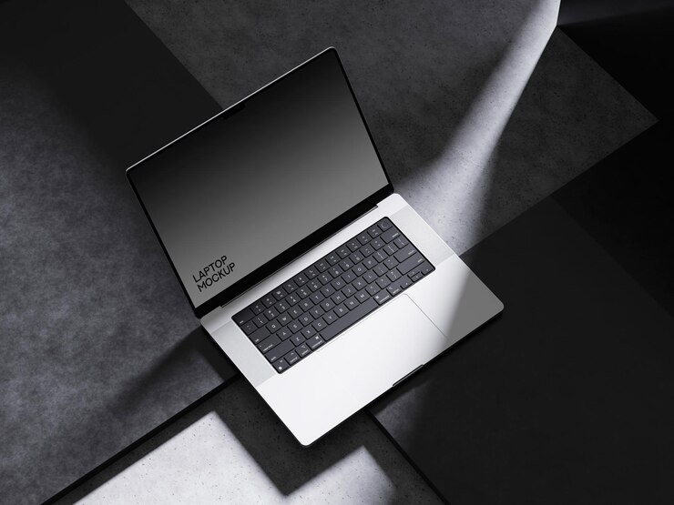 PSD laptop mockup on a dark surface