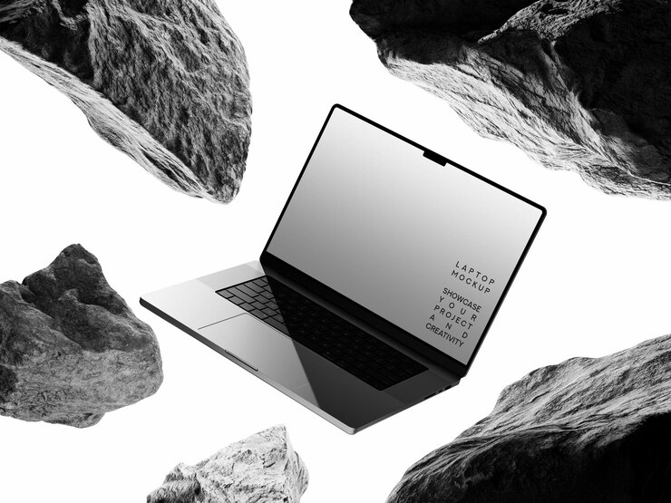 PSD laptop mockup floating amongst rocks