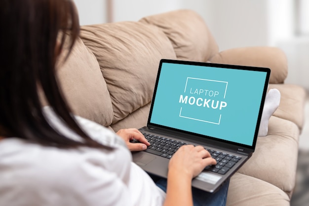 Laptop mockup in the girl's lap