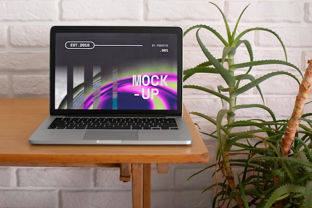 PSD laptop mockup on table