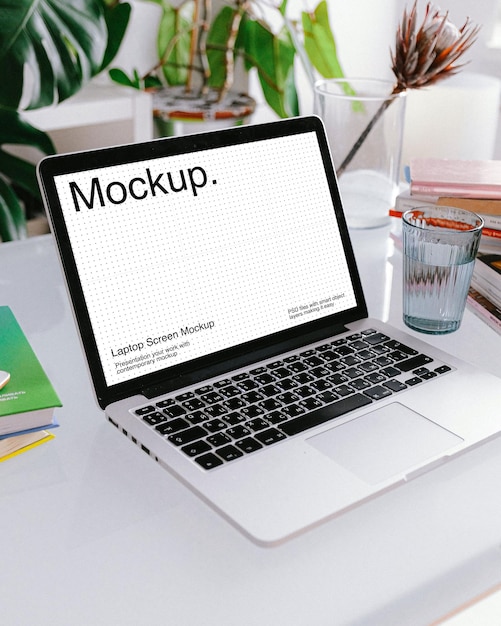 Laptop mockup on white table