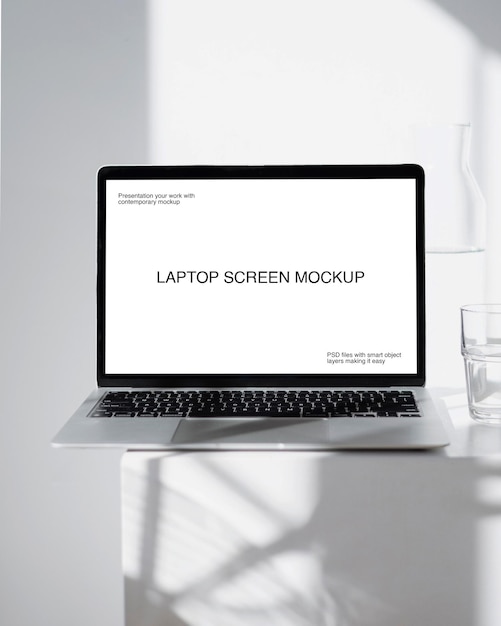 PSD a laptop mockup on a white table