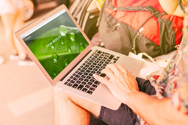 Laptop mockup with camping in nature concept