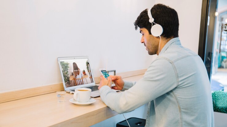 PSD laptop mockup with man