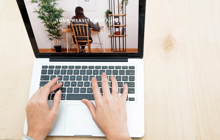 PSD laptop mockup with woman working at home