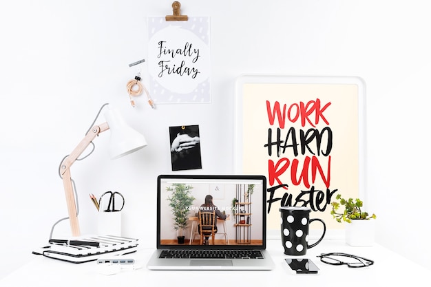 Laptop mockup with workspace composition