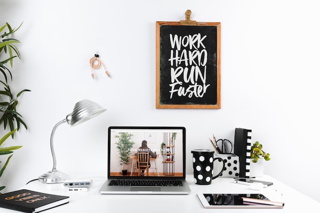 laptop mockup with workspace composition