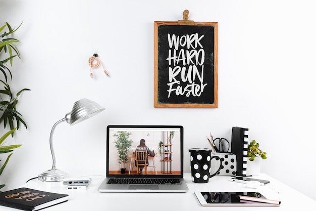 PSD laptop mockup with workspace composition