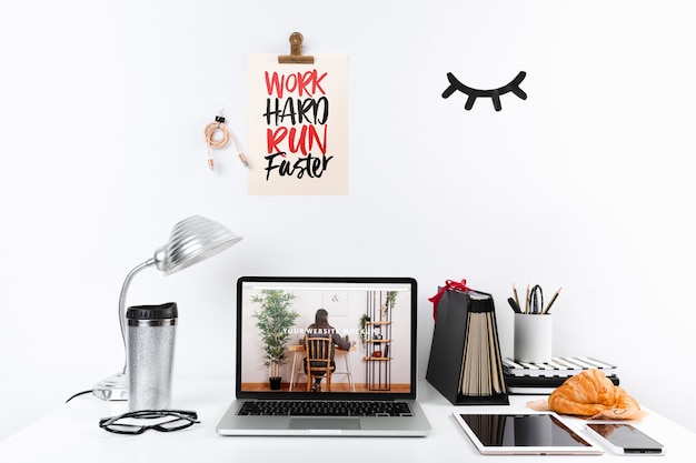 Laptop mockup with workspace composition