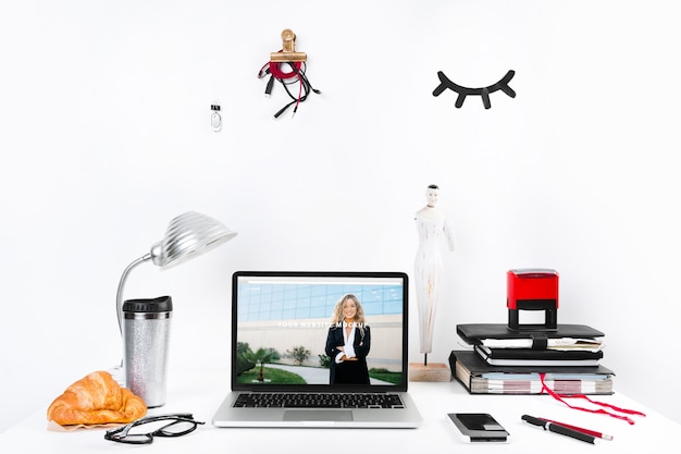 Laptop mockup with workspace composition