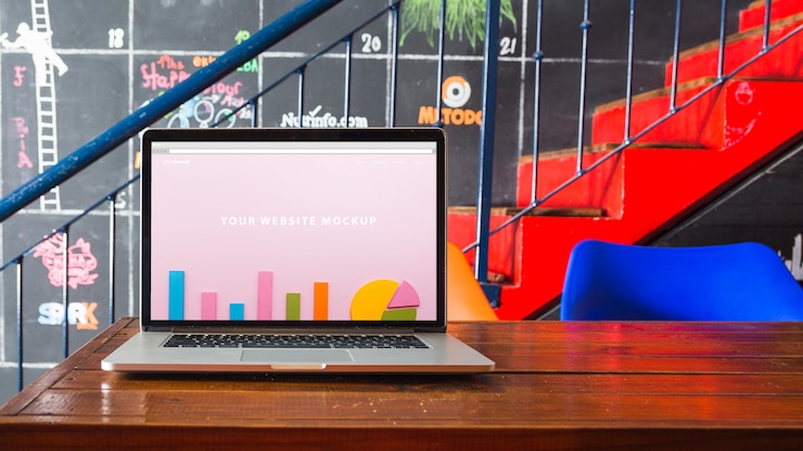 PSD laptop mockup on wooden table