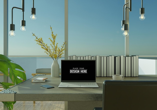 Laptop na biurku w makiecie miejsca pracy