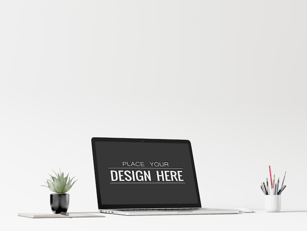 Laptop op bureau in werkruimte psd-mockup